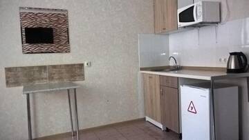 Фото номера Двухместный номер Комфорт с двуспальней кроватью Апартаменты Рантье на улице Карасунская 184 г. Краснодар 4